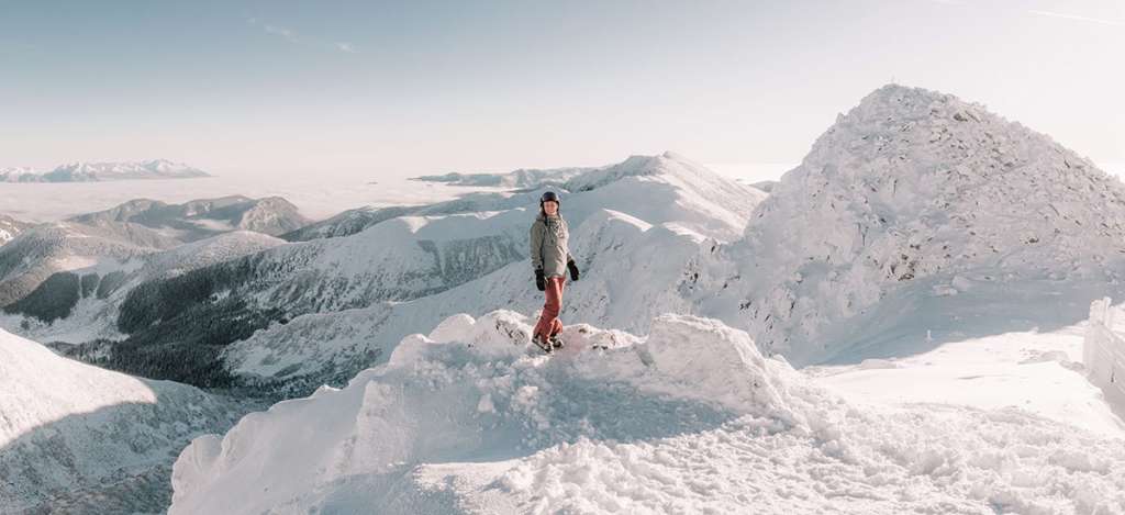 A skier in the mountains and views of Jasná