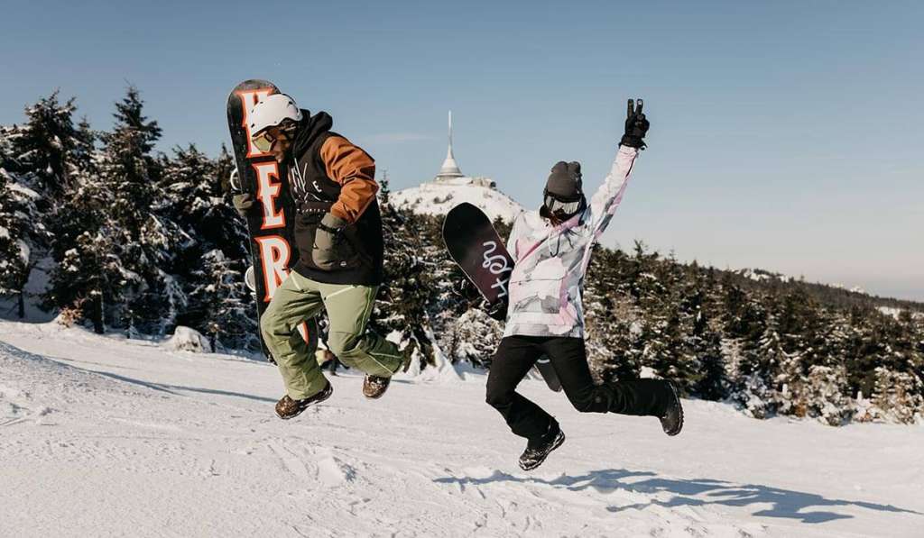 Cheerful snowboarders in the Ještěd Ski Resort