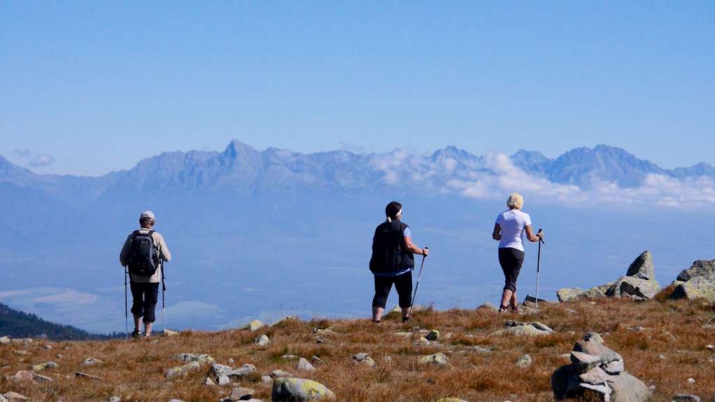A group of hikers on a walk along the mountain ridge